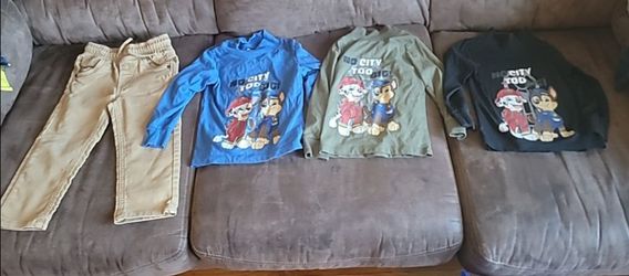 Size 2T paw patrol shirts and tan pants