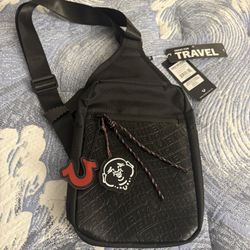 True Religion Wennington Sling Crossbody Black Embossed Logo Buddha Charm NWT