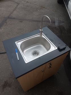 Portable sink with locking  cabinetpump