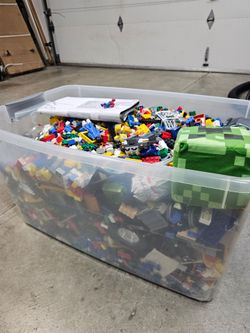 60 qt bin full of Mega bloks, figures and misc toys