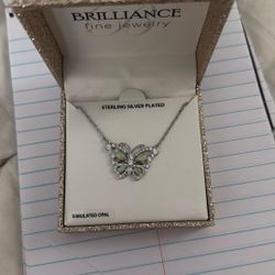 Brilliance Fine Jewelry necklace — specifically, a sterling silver‑plated butterfly pendant featuring simulated opal 