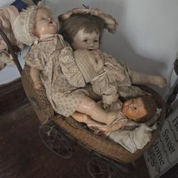 Antique Baby Carriage And Dolls