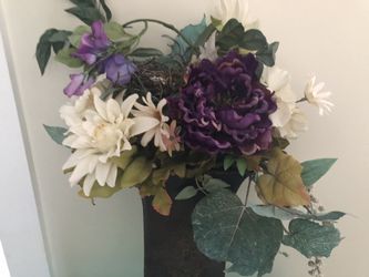 floral ornament in a metal planter