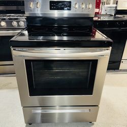 Frigidaire stainless steel stove with a receipt for a 60-day warranty