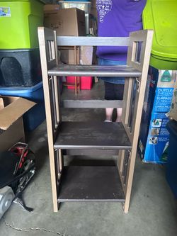 Two little shelves. Barstool.. and a vacuum cleaner.
