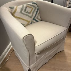 Two Cream Swivel Armchairs 