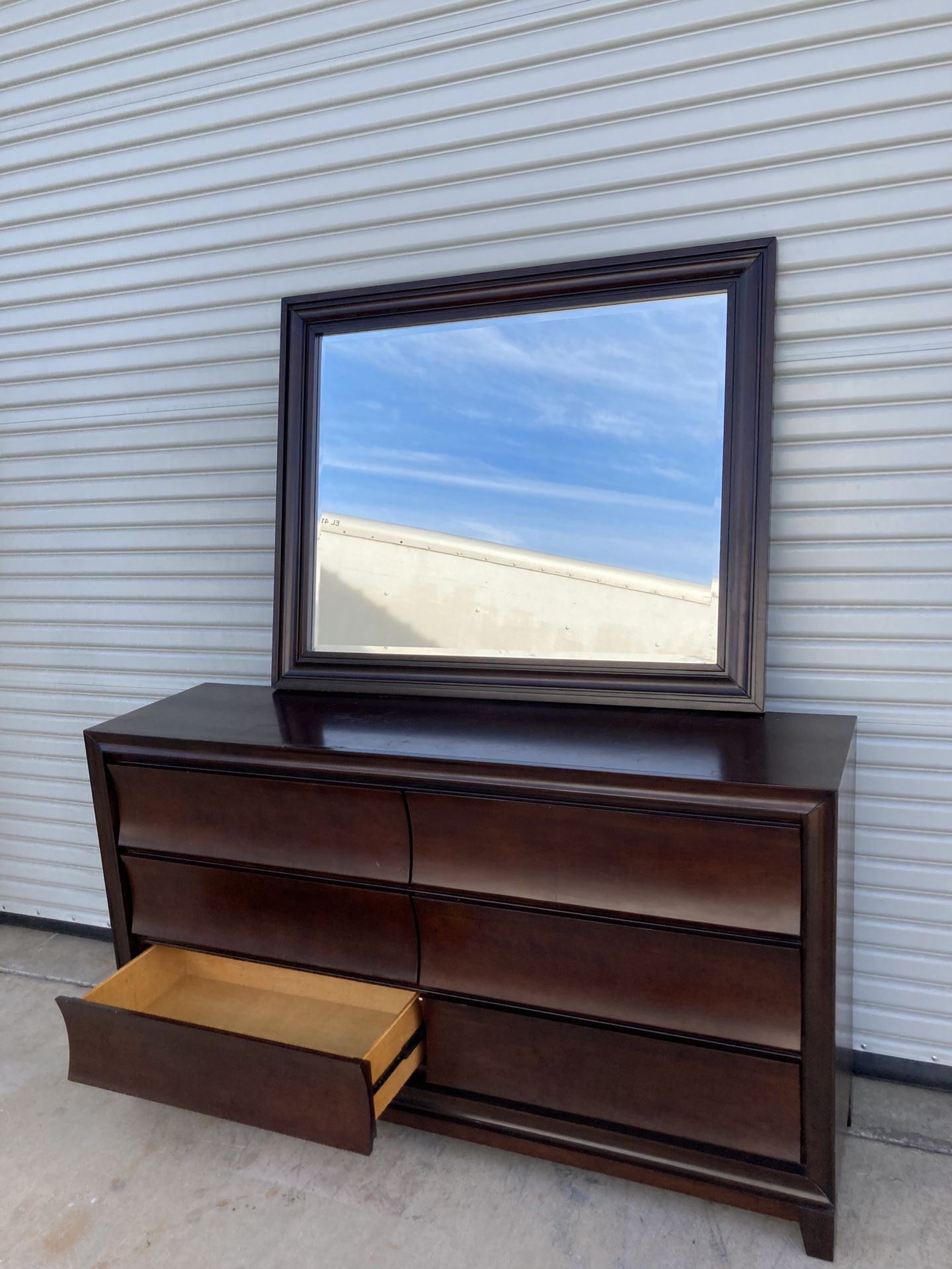 66” 6-drawer dresser in dark brown with a matching mirror. 