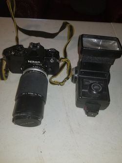 Nikon FM2 with zoom lens, 50mm lens and flash