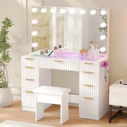 43" Glass Top Makeup Vanity With Mirror and Outlet, Makeup Table with 3-Color Mode Smart RGB Ambient Adjustable Colorful Lighting, And 9 Drawers