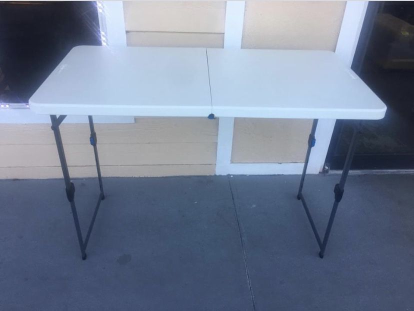 New 4' Height Adjustable Fold in Half Table, White Granite