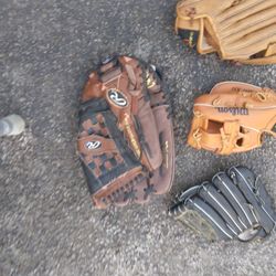 FIVE.       BASEBALL GLOVES.  DIFFERENT  SIZES