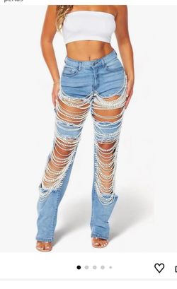 Women's cropped straight-leg mid-rise jeans with rhinestone rips and pearl bead details.