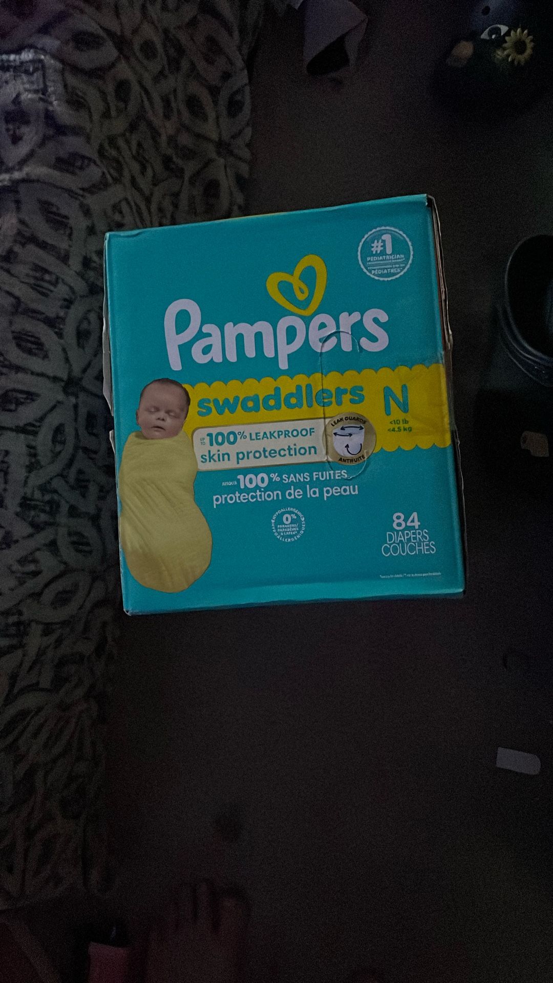unopened box of pampers diapers