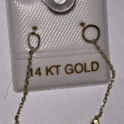 14 karat yellow gold chain-link earrings with leaf-shaped pendants.