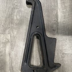 1968 NOS HOOD LATCH  SUPPRT BRACKET IMPALA CAPRICE WAGON BISCAYNE 