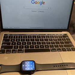 MacBook Pro And A Apple Watch 