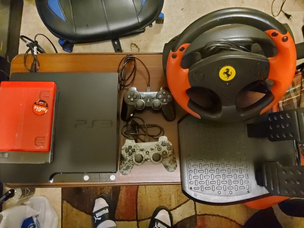Sony  PS3 Slim Bundle With Two Sony Wireless Controllers and With farrier steering Wheel 