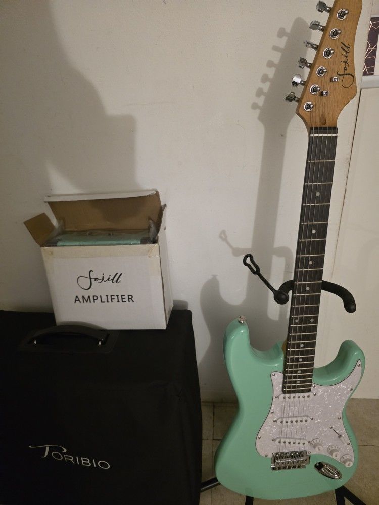 New Beginners Electric Guitar With Amp And Accessories.