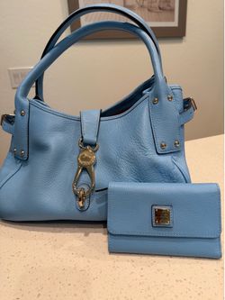 Blue pebble, leather, Dooney and Burke purse and matching wallet.