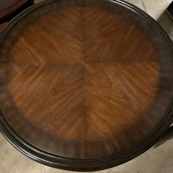 Two Round Wood Tables With Rattan Bottom Shelf