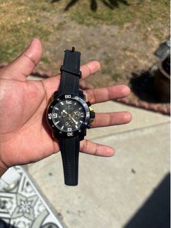Black and gold Invicta men’s watch