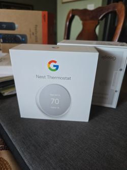 2 Goggle nest smart thermostat in the box