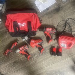 4 Milwaukee Power Tools/ 2 12v Batteries And Charger 