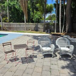$25 each set pair of white wicker outdoor patio chairs or red metal frame bistro set