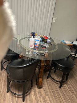 Glass table with leather stools