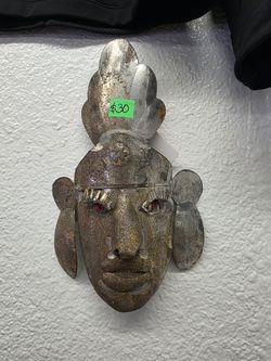 Vintage Mexican folk art punched and hammered metal face mask with red glass eyes, $30, only 9 inch tall