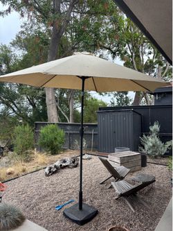 large beige umbrella with stand sun shade backyard