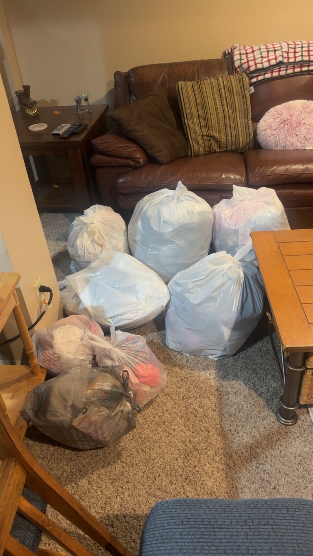 Bags of baby girl stuff and some women’s clothes