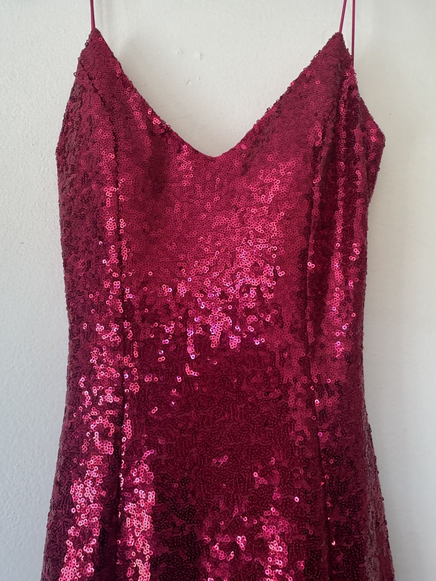 A very beautiful dress in a bright pink color with sparkle.