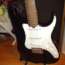 GUITARRA. ELÉCTRICA.  CON.  BASE