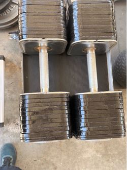 Iron master quick lock adjustable dumbbells 110 pounds each 220 pounds total  plus stand and extra screws in good condition but not perfect they do ha