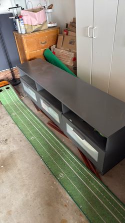 Free for pick up. TV stand with 3 drawers.