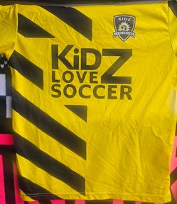 Bright yellow youth soccer jersey.