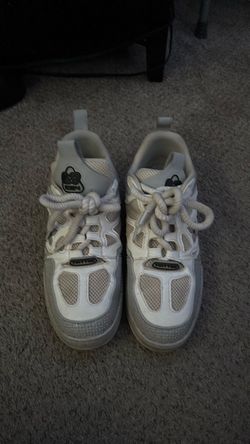lv skates with crease protectors and worn