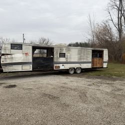 Travel trailer for parts or repair.  Would make a good chicken coop.  1st thing a tree fell on it.  2nd thing, there no title.  Sold as is for parts o