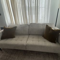 Beige Coach With Black Legs 