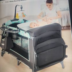 Bedside  bassinet crib with changing table brand new