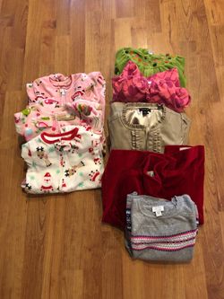 2 years old. 2T onesies and sweaters and jacket