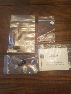 Miniature broom, flyswatter, phone and toothbrush