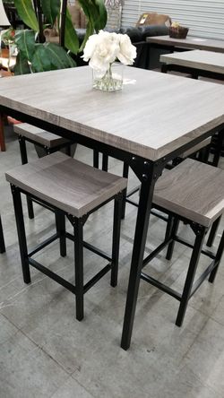 Grey counter height table with 4 stools
