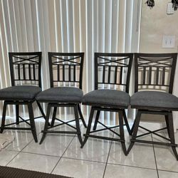 4 Wrought-Iron Swivel Bar Stools