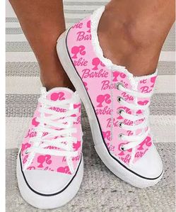 pink canvas Barbie slip-on sneakers featuring a raw edge fringe detail and white rubber toe caps