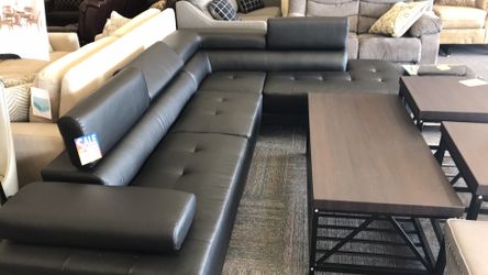Black sectional with adjustable head rests