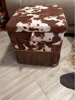 Western footstool opens for storage