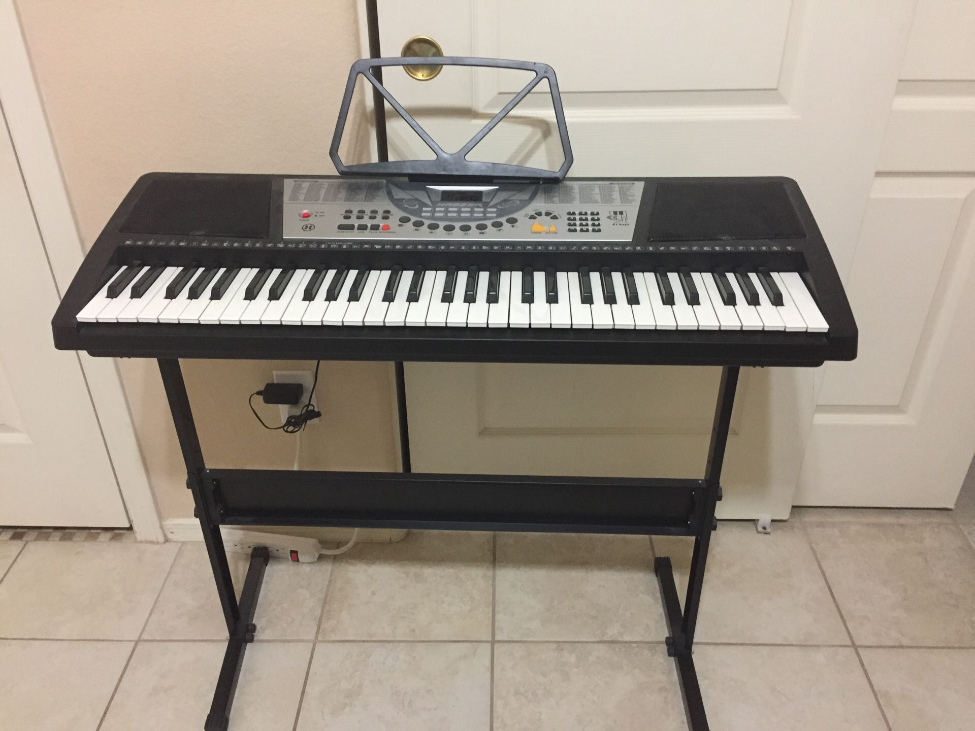 Keyboard piano with stand and music sheet holder