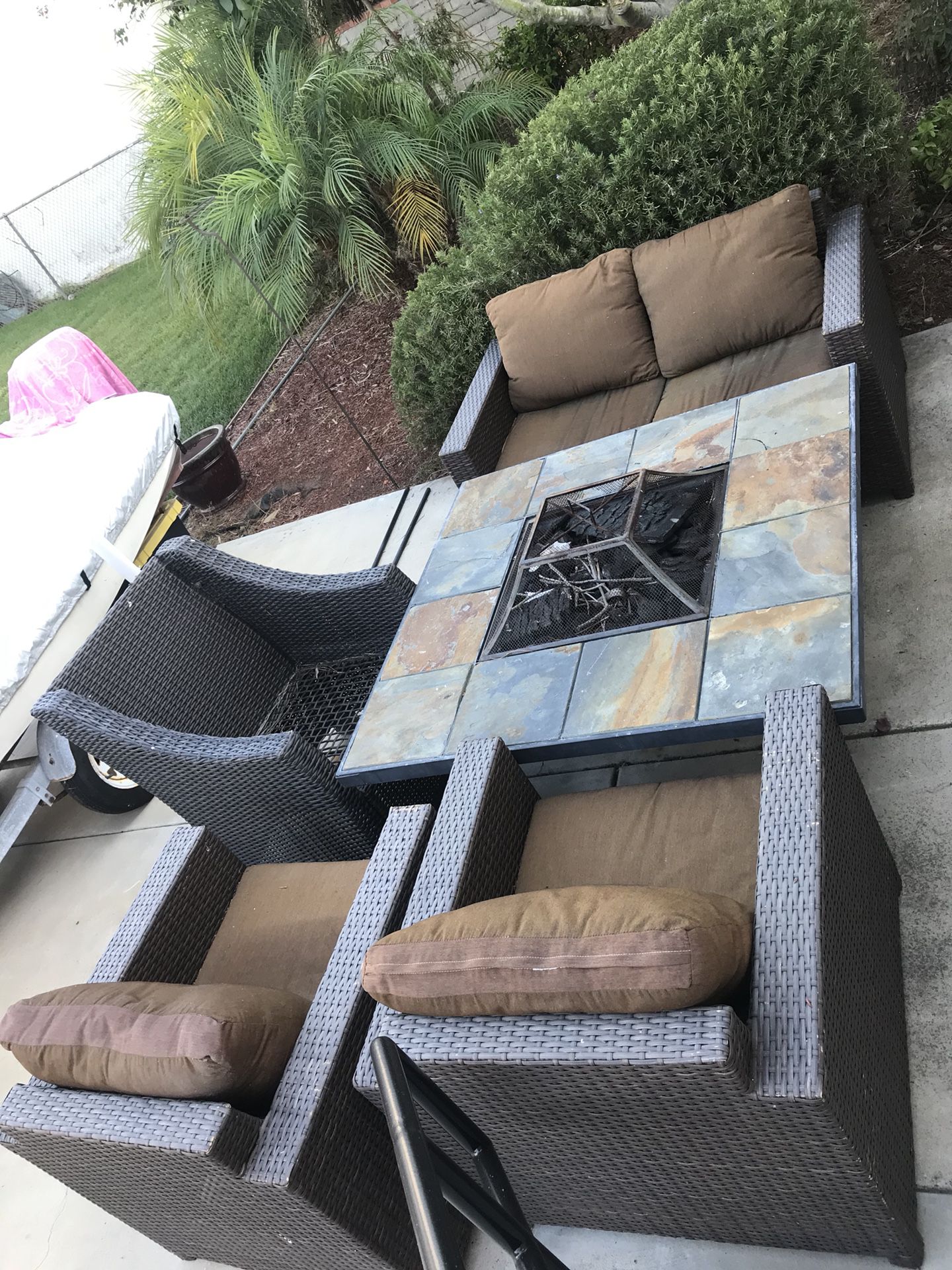 Wicker patio furniture and fire pit